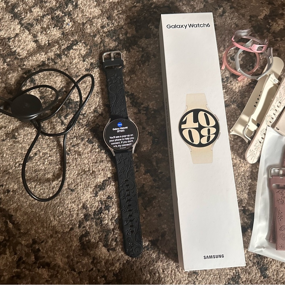 Samsung Galaxy Watch6 with Black and Pink Bands